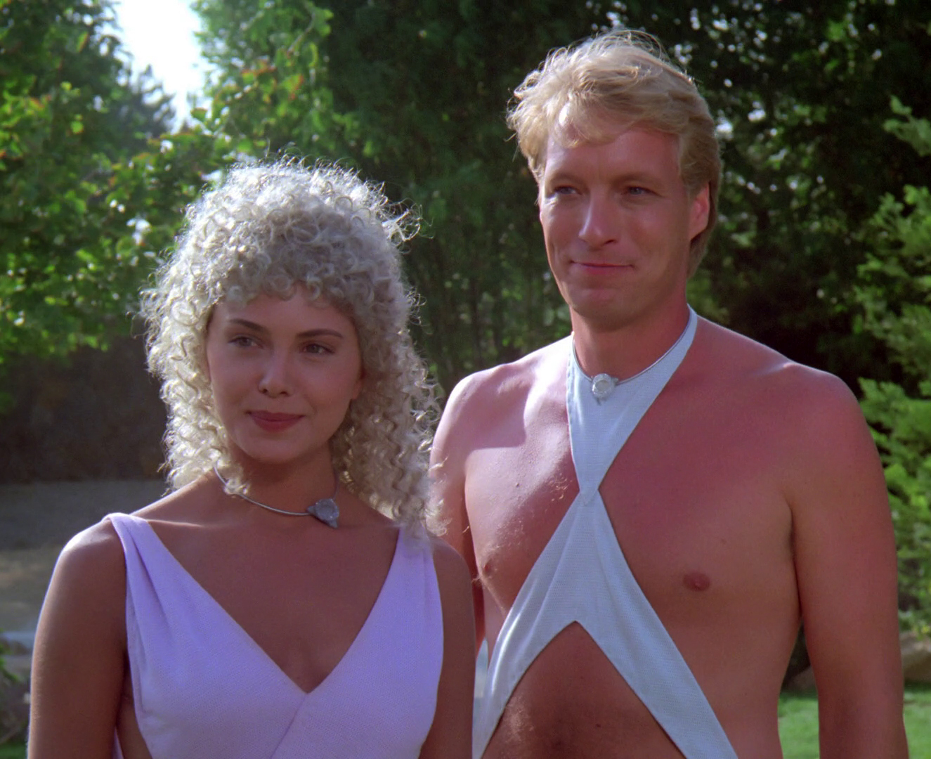 Two people from TNG episode 8, Justice, in some of the goofiest outfits this side of Risa.